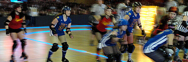 Jammers skating through the pivots and blockers … Queen City Roller Girls